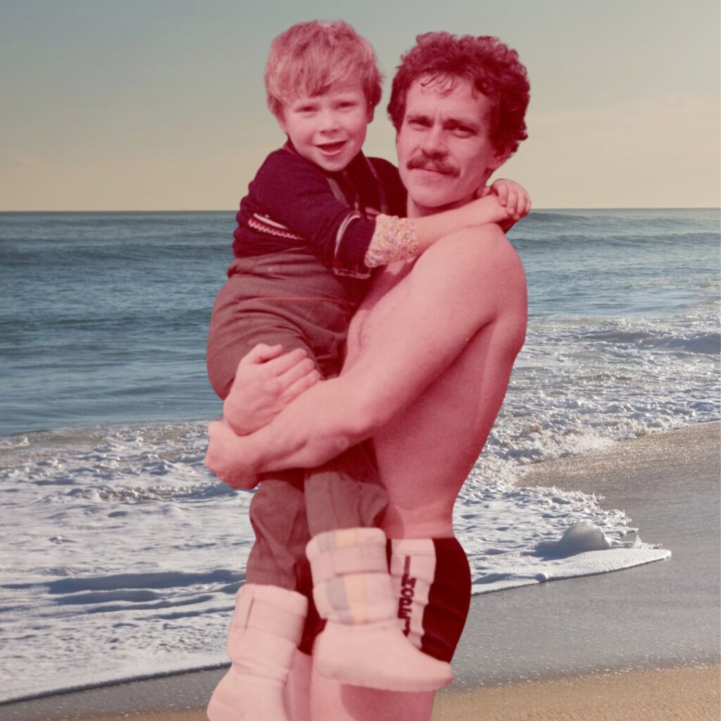 Dad holding his son at the seaside treatment